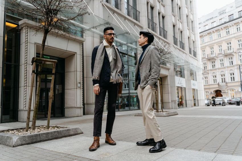 friends standing outside, having a deep conversation