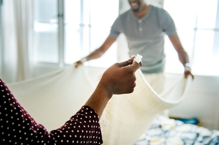 couple folding laundry