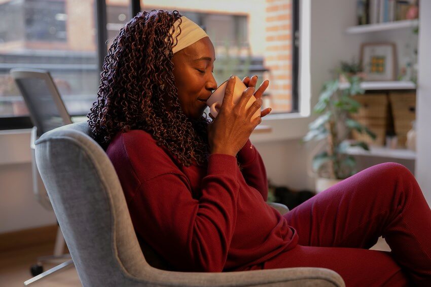 woman savoring her morning cup of coffee