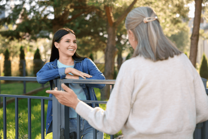 woman expressing her gratitude to another woman who's smiling