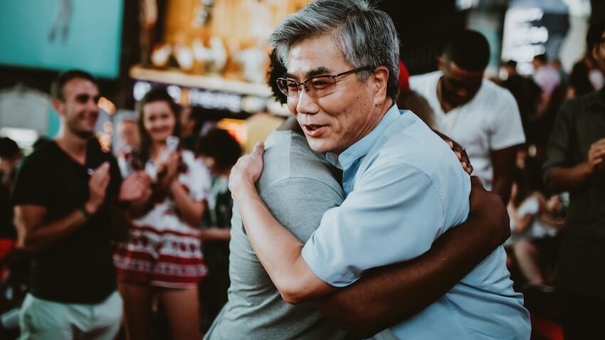 man expressing gratitude to another in public