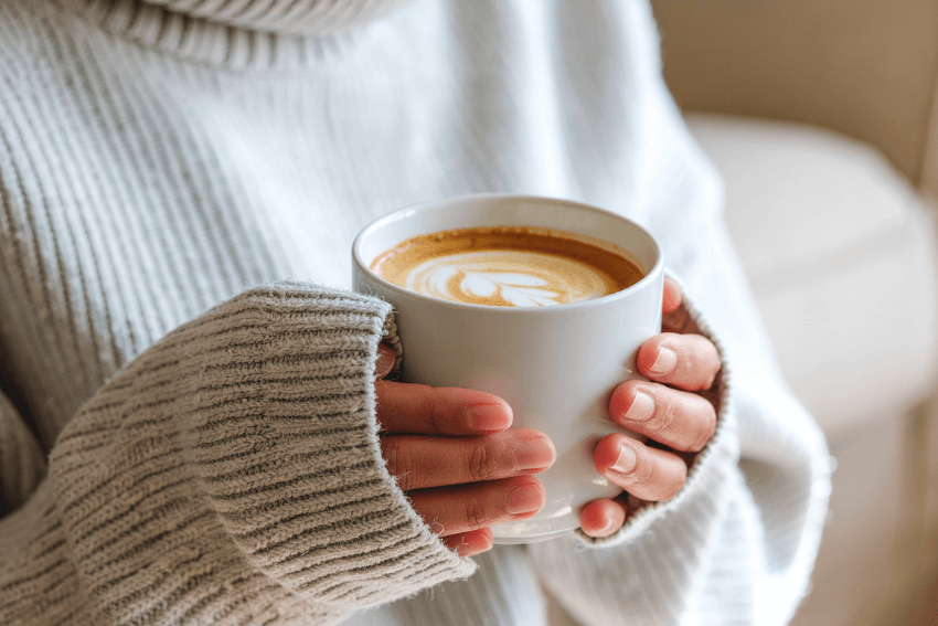 woman holding a cup of coffee