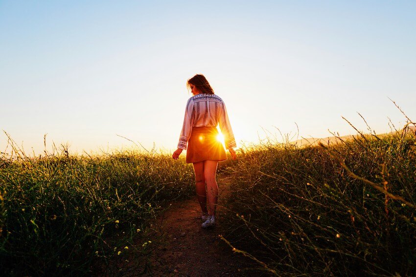 woman taking a gratitude walk outside